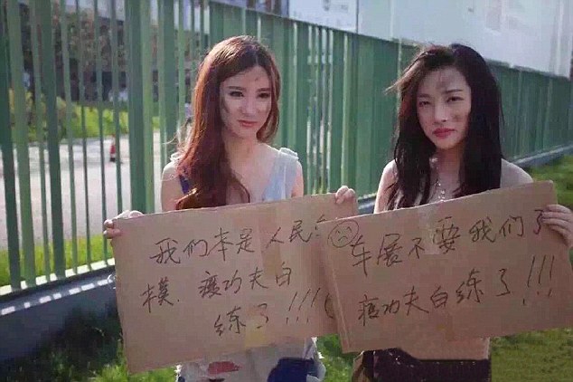 Pic shows: Models claiming they need the work to survive after being banned from appearing at the Shangai International Car Industry Exhibition in China. Scantily clad models were controversially banned from appearing at the Shanghai International Car Industry Exhibition in China. Traditionally, the girls have draped themselves across luxurious new cars, enticing buyers and the public to admire their sleek new lines. But organisers decided they wanted buyers to concentrate on the contours of the cars only and informed the models they would not be needed. The ban caused street protests from the leggy girls who dressed as beggars claiming they needed the work to survive. Holding up placards at a metro station near the auto show at The National Convention Centre in Shanghai they wrote: "I cant be a showgirl anymore; all that thinning was for nothing. Im here to beg for food." "We are unemployed." On others they begged :"Auto show do not forsake us. " "Showgirls are people too. Thinning was for nothing." "The world is big; we want to survive." Model An Ran, 20, who has been a showgirl for two years, said:"I think this is a ridiculous ban. Models have always promoted cars in this industry. We are professional models who do a good job." Visitors travelling long distances to the show in the past have always admitted admiring both the cars and the glamorous models who pose next to the cars. Some manufacturers have even insisted on choosing the girls outfits and the colour to showcase their cars in the best light. But organisers of the current show officially announced a ban on the models and children attending the event out of "safety concerns". Some shows in China have become notorious for models in over-revealing outfits. Sometimes, these auto shows have been referred to as "flesh shows." Critics claim manufacturers should improve their products, rather than have pretty girls posing all over the cars for sexy photo shoots. Determined Gu Chuting, head of the organizing committee, said they will review the ban after they see how things go during the exhibition. He said exhibitors had acknowledged the new rules which were meant to encourage people to focus more on the cars. ends