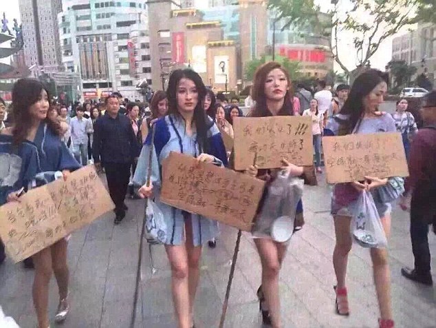 Models Protest At Car Show Ban