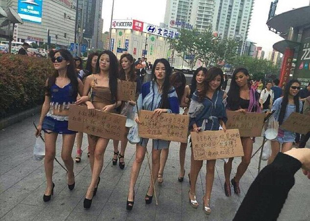 Models Protest At Car Show Ban